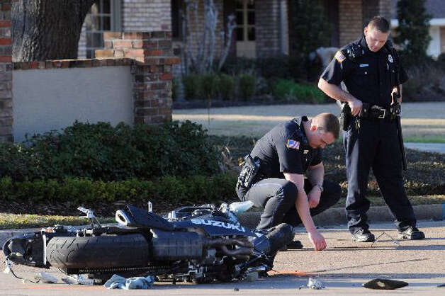 Beaumont Police Officers examine the accident scene where a 22-year ...