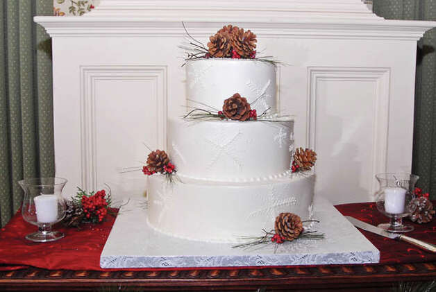 Their threetiered wedding cake was decorated with snowflakes made of butter