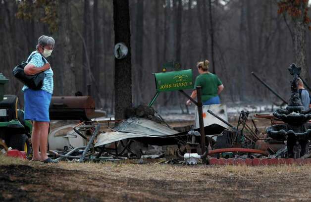 Firefighters make slow headway on wildfires - Houston Chronicle