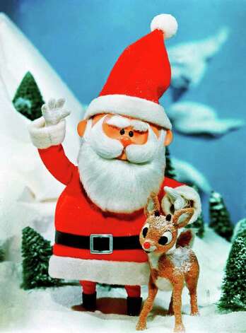 ADVANCE FOR TUESDAY PMS, NOV. 24--Santa stands beside his favorite reindeer, Rudolph, in a scene from  'Rudolph the Red-Nosed Reindeer,' television's  longest-running special. CBS will rebroadcast the classic animated feature this Christmas season,  on Nov. 30  at 8 p.m., EST. It was originally broadcast on CBS (AP Photo/CBS) / CBS