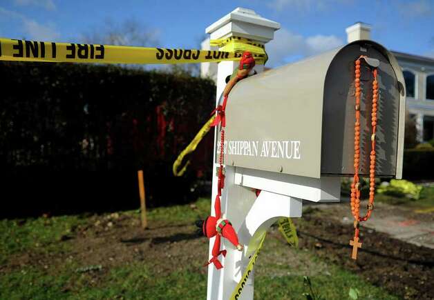 Rosary beads hang from the mailbox at 2267 Shippan Ave on Wednesday 
