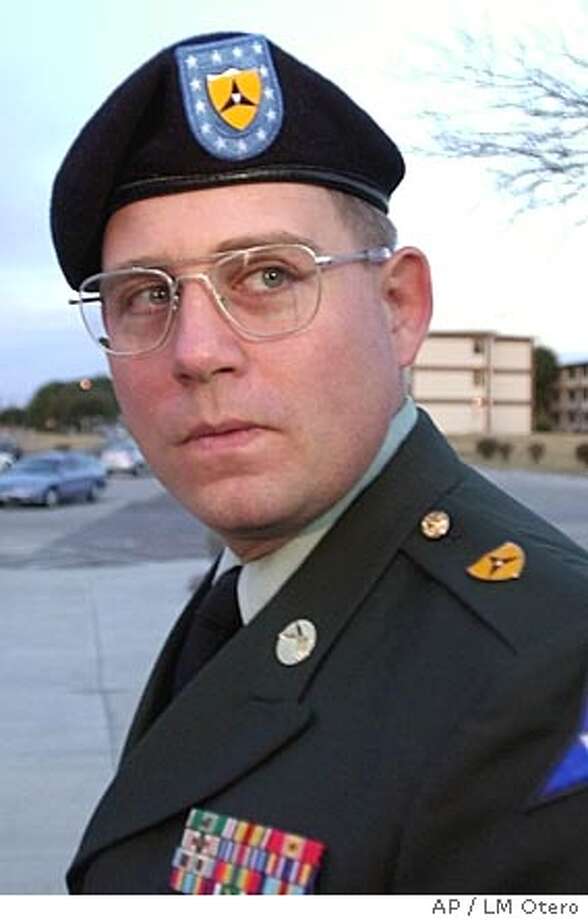 Army orders Jan. court-martial for GI in Abu Ghraib photos 