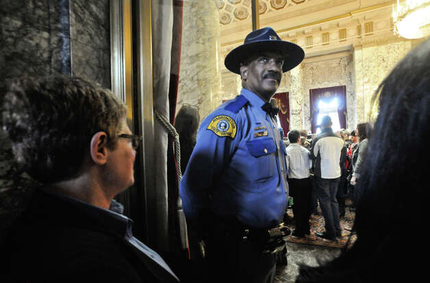 Joshua Williams of the Washington State Patrol stands outside the State 