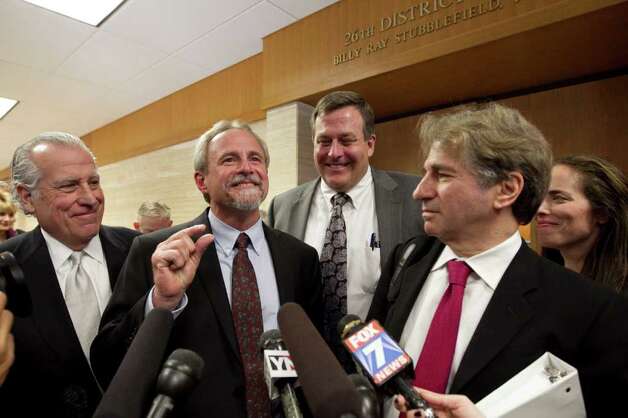 Michael Morton, second from left, and his legal team speak to the media after Judge Sid Harle ruled in favor of a court of inquiry for Judge Ken Anderson at the Williamson County Justice Center in Georgetown. Photo: Jay Janner / Austin American-Statesman