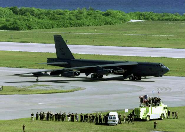U.S. Air Force personnel wave at a B-52H Stratofortress bomber as it taxis for take off on a strike mission against al Qaeda terrorist training camps and military installations of the Taliban regime October 7, 2001 in an unknown location. Photo: USAF, Getty Images / Getty Images North America