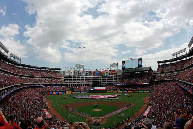A B-52 flies over the Rangers Ballpark in Arlington during Opening Day on April 1, 2011 in Arlington, Texas. Photo: Tom Pennington, Getty Images / 2011 Getty Images