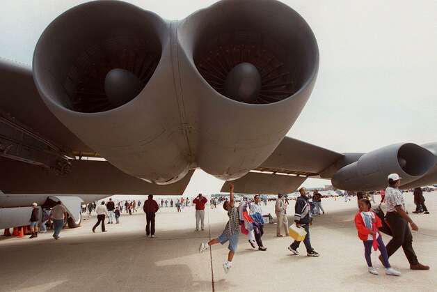 A boy reaches up to touch a B-52 at the Department of Defense Joint Services Open House on May 17, 1997 at Andrews Air Force Base, Md. Photo: JAMAL A. WILSON, JAMAL A. WILSON/AFP/Getty Images / AFP