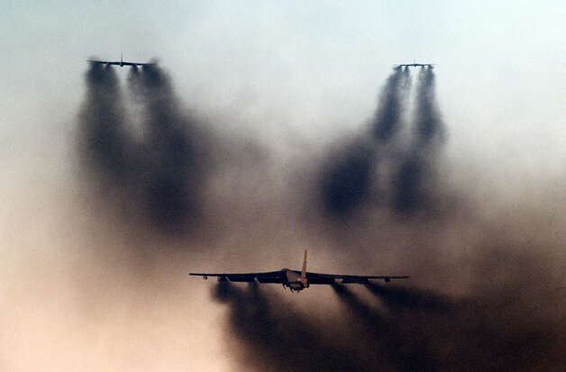 This undated photo shows three B-52s departing in formation during a minimum interval takeoff exercise, in which three cells of six B-52 and KC-10 Extender aircraft take off seconds apart under combat conditions. Photo: USAF, U.S. Air Force / Getty Images North America