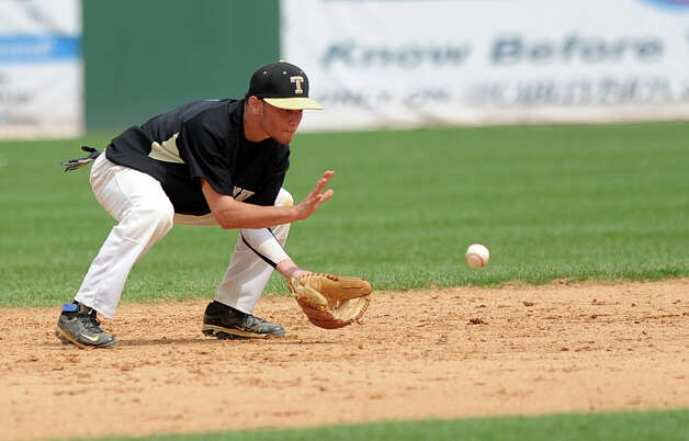 Trumbull's Brandon Liscinsky fields a ball during Saturday's FCIAC baseball championship game at the Ballpark at Harbor Yard in Bridgeport on May 26, 2012. Photo: Lindsay Niegelberg / Stamford Advocate