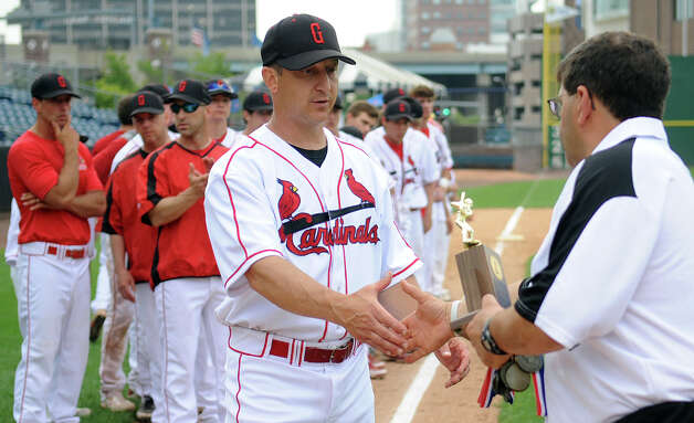 Greenwich is presented with a runner-up trophy after losing to Trumbull in Saturday's FCIAC baseball championship game at the Ballpark at Harbor Yard in Bridgeport on May 26, 2012. Photo: Lindsay Niegelberg / Stamford Advocate