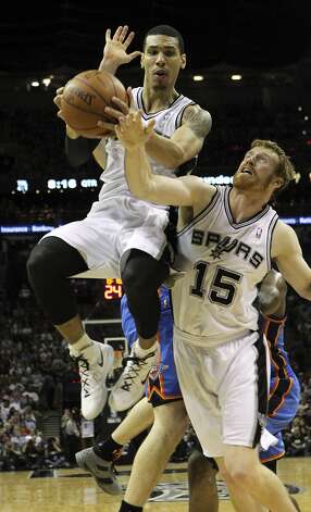 San Antonio Spurs' Danny Green (4) grabs a rebound near San Antonio Spurs' Matt Bonner (15) during the first half of game two of the NBA Western Conference Finals in San Antonio, Texas on Tuesday, May 29, 2012. Kin Man Hui/Express-News (Kin Man Hui / San Antonio Express-News) / SA
