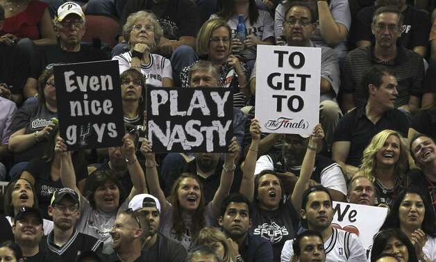 Fans hold up signs during the first half of game two of the NBA Western Conference Finals in San Antonio, Texas on Tuesday, May 29, 2012. Kin Man Hui/Express-News (Kin Man Hui / San Antonio Express-News) / SA