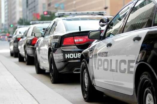 Houston Police Department reveals the new image for future HPD patrol vehicles  outside Houston Police Department Headquarters in Downtown on Monday, July 2, 2012, in Houston.  HPD tested vehicles for the new patrol cars, along with the new black and white color scheme and logo design. Photo: Mayra Beltran, Houston Chronicle / © 2012 Houston Chronicle