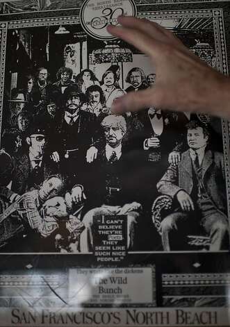 AD Winans shows himself in a smaller version of a 1970's poster of poets gathered at Vesuvio bar, in the North Beach neighborhood of San Francisco, Calif on Friday, July 13, 2012. Photo: Yue Wu, The Chronicle / SF