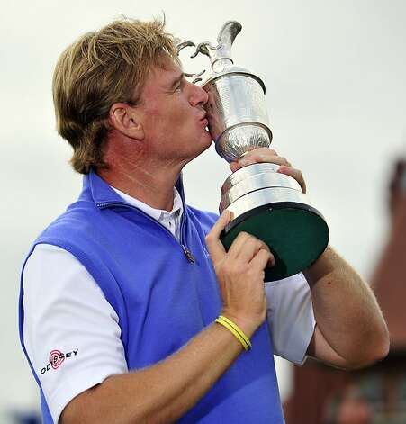 Ernie Els of South Africa kisses the Claret Jug, 'The Golf Champion Trophy' after winning the 2012 British Open Golf Championship at Royal Lytham and St Annes in Lytham, north-west England, on July 22, 2012. Els won the championship with a score of 273, one shot clear of Adam Scott of Australia. AFP PHOTO / GLYN KIRKGLYN KIRK/AFP/GettyImages Photo: Glyn Kirk, AFP/Getty Images / SF