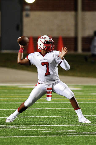 Lamar quarterback Darrell Colbert takes hold of his passing game against West Brook at the Beaumont ISD Thomas Center on Saturday, September 15, 2012.
Photo taken:
Randy Edwards/The Enterprise