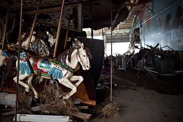 KEANSBURG, NJ - NOVEMBER 01: A heavily damaged carousel sits inside Keansburg Amusement Park after Superstorm Sandy swept across the region, on November 1, 2012 in Keansburg, New Jersey. Superstorm Sandy, which has left millions without power or water, continues to effect business and daily life throughout much of the eastern seaboard. Photo: Andrew Burton, Getty Images / 2012 Getty Images