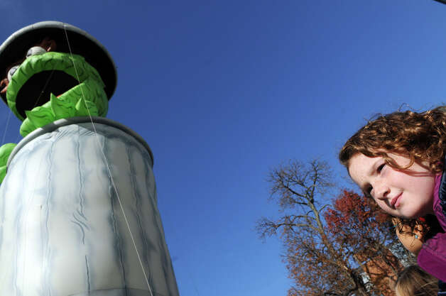 Laure Mirando, 9, watches as Oscar the Grouch passes by during he UBS Parade Spectacular in Stamford, Conn., Nov. 18, 2012. Photo: Keelin Daly / Stamford Advocate Freelance