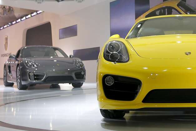 The new Porsche Caymans are introduced at the LA Auto Show in Los Angeles, Wednesday, Nov. 28, 2012. (AP Photo/Jae C. Hong) Photo: Jae C. Hong, Associated Press / SF