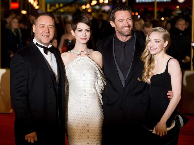 Russell Crowe (L) Anne Hathaway (2-L) Hugh Jackman (2-R) and Amanda Seyfried (R) pose for photographers on the red carpet ahead of the world premiere of Les Miserables in central London on December 5, 2012. AFP PHOTO/Leon Neal/Getty Images Photo: LEON NEAL, AFP/Getty Images / AFP