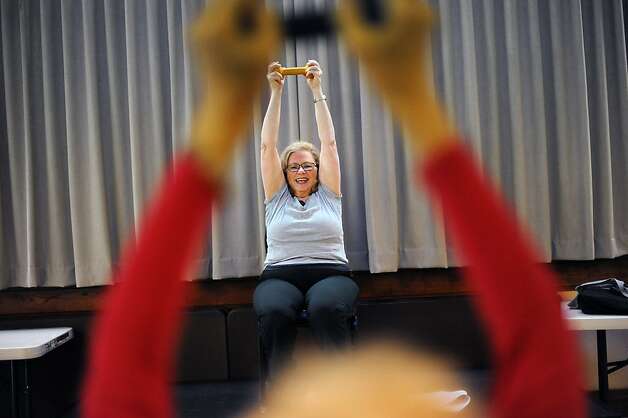 Nancy Agronin, whose osteoporosis is linked to breast cancer treatment years ago, now teaches a Sit and Be Fit class. Photo: Michael Short, Special To The Chronicle / SF