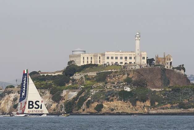The Maserati passes Alcatraz after completing a 47-day trip from New York. Photo: James Tensuan, The Chronicle