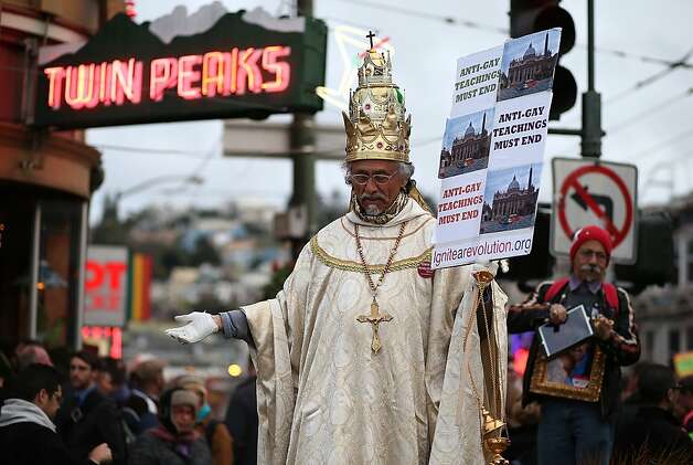 SAN FRANCISCO, CA - MARCH 25:  A same-sex marriage supporter dressed as the pope holds a sign during a rally in support of marriage equality on March 25, 2013 in San Francisco, California. Supporters of same-sex marriage held a rally and are set to march through San Francisco a day before the U.S. Supreme Court will hear arguments on California's Proposition 8, the controversial ballot initiative that defines marriage as between a man and a woman.  (Photo by Justin Sullivan/Getty Images) Photo: Justin Sullivan, Getty Images