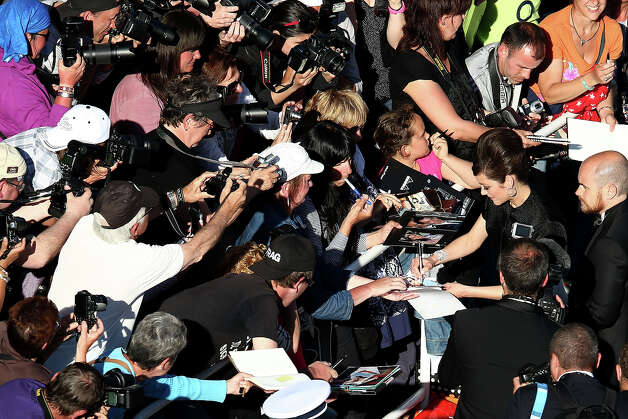 Marion Cotillard signs autographs at the "Blood Ties" Premiere during the 66th Annual Cannes Film Festival at Grand Theatre Lumiere on May 20, 2013 in Cannes, France. Photo: Andreas Rentz, Getty Images / 2013 Getty Images