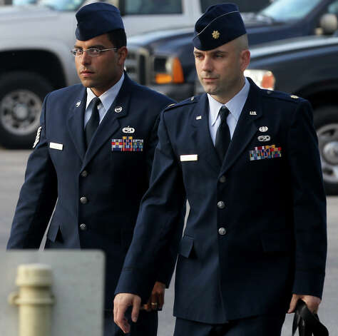Air Force Tech Sergeant Jaime Rodriguez (left) heads for court Thursday June 6, 2013 at Joint Base San Antonio-Lackland. He is accused of having illicit contact with 18 women, and having sex with four of them. Photo: SAN ANTONIO EXPRESS-NEWS / ©San Antonio Express-News