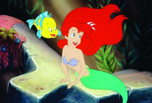 Princess Ariel and her friend Flounder in a scene from 