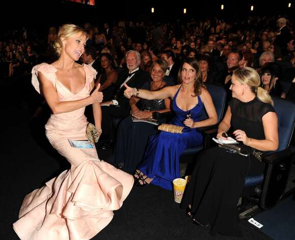 From left, Julie Bowen, TIna Fey and Amy Poehler in the audience at the 65th Primetime Emmy Awards at Nokia Theatre on Sunday Sept. 22, 2013, in Los Angeles. (Photo by Frank Micelotta/Invision for Academy of Television Arts & Sciences/AP Images) Photo: Frank Micelotta/Invision/AP