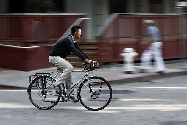 Photo: Wang rode cross-country, and his bike was promptly stolen in S.F. - and returned. Photo: Michael Macor, The Chronicle . 