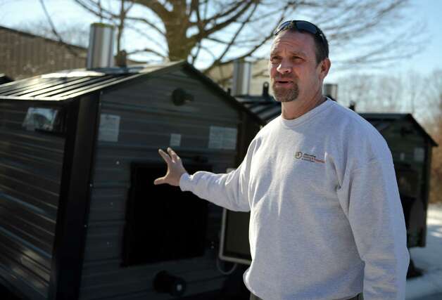 Jeff Luff talks about the new EPA regulations that will effect wood burning stoves like the ones he sells at his outdoor wood furnace shop, CT Wood Furnace in Oxford, Conn. Photo: Autumn Driscoll / Connecticut Post