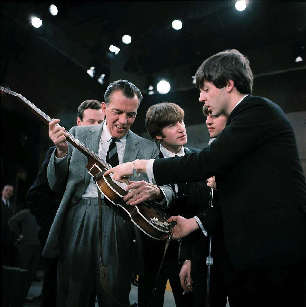 SorryAs they performed, the words under John Lennon's name said "Sorry Girls, He's Married." Photo: Uncredited, STF / AP
