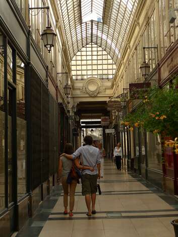 Locals stroll through Passage du Grand Cerf, one of the remaining covered passages in Paris. Photo: Spud Hilton, The Chronicle