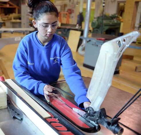 Sophomore Zamarie Rivera adjusts the table saw Thursday, Feb. 27, 2014, during carpentry class at Bullard-Havens technical school in Bridgeport, Conn. Photo: Autumn Driscoll / Connecticut Post