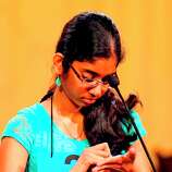 Pearland Junior High West&#39;s <b>Shobha Dasari</b> writes a word on her palm before ... - square_gallery_thumb