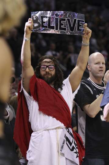 A fan dresses as Jesus Christ makes his appearance at Game 5 of the first round of the Western Confe