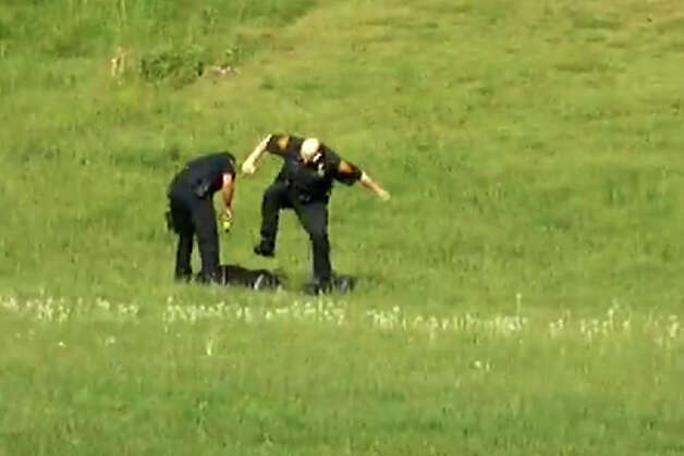 A screen grab from a video, posted on YouTube on Jan. 6, 2013, showing three Bridgeport, Conn. police officers kicking a man in Beardsley Park on May 20, 2011. On Tuesday, May 27, 2014 city officials said they agreed to settle the man's civil rights lawsuit against the Police Department, paying him $198,000. Photo: Contributed Photo / Connecticut Post Contributed