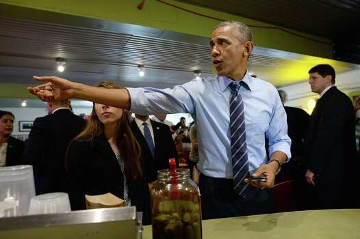 President Barack Obama orders barbecue at Franklin Barbecue in Austin on Thursday, July 10, 2014. Photo: JEWEL SAMAD, AFP/Getty Images / AFP