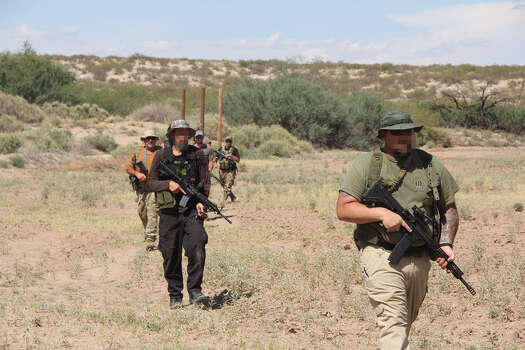 Photos showing dozens of members of the militia groups on the U.S.-Mexico border carrying semi-automatic rifles and wearing masks, camouflage and tactical gear provide one of the first glimpses into the group's activities on the border. Photo: Provided To The San Antonio Express-News