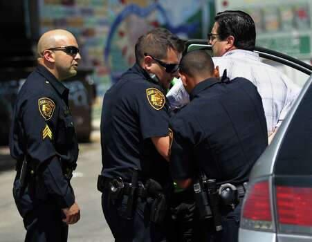 During a sting operation conducted Friday, SAPD officers arrest a man suspected of soliciting prostitution in the 500 block of San Patricio Street in San Antonio. Photo: Timothy Tai / San Antonio Express-News / Â© 2014 San Antonio Express-News