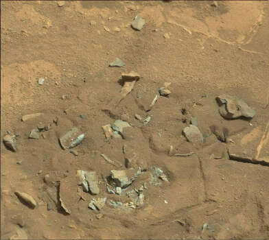 Bones on Mars? The space watchers at UFOblogger.com say this image shot by NASA's Curiosity rover on the surface of Mars shows what looks like a thigh bone. Can you see it? Photo: NASA