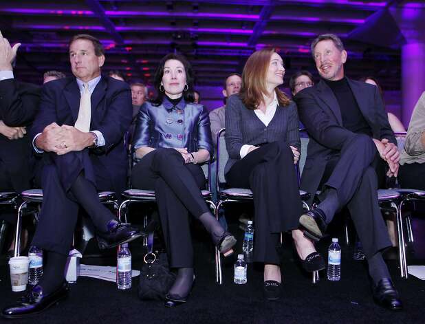 Oracle Corp. CEO Larry Ellison, right, with his wife, Melanie Ellison, second from right, Oracle's co-Presidents Mark Hurd, left, and Safra Catz, listen during a keynote address, Wednesday, Sept. 22, 2010, at Oracle World in San Francisco. Hurd is the former CEO of Hewlett-Packard Co. Photo: Paul Sakuma, AP