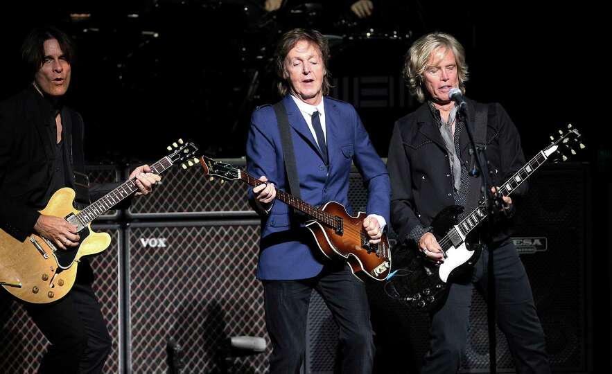 Rock icon Sir Paul McCartney (center) performs at the Tobin Center on Wednesday, Oct. 1, 2014.
