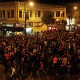 Giants fans on Valencia St. celebrate their team's victory in the 2014 World Series on Wednesday, Oct. 29, 2014.