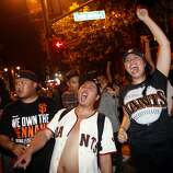 Giants fans celebrate in front of Willie Mays Plaza after the end of Game 7 of the World Series in San Francisco, Calif., on Wednesday, October 29, 2014.