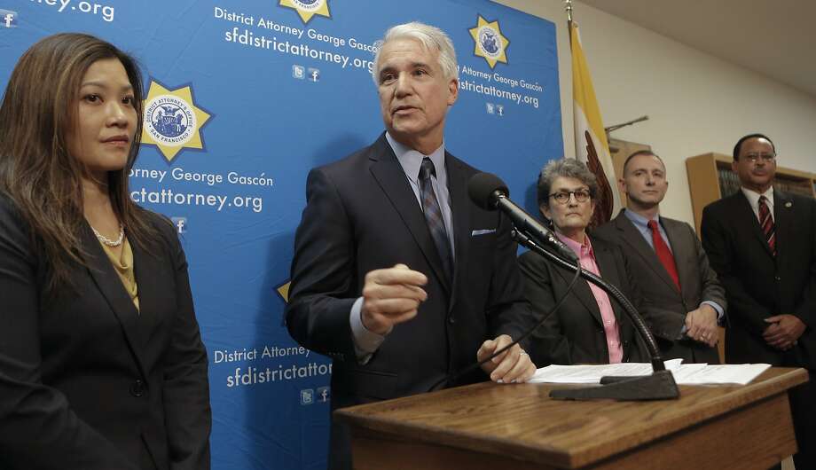 San Francisco District Attorney George Gascon, (center) is joined by assistant district attorneys Nancy Tung, (left), June Cravett, Ernst Halperin and the head deputy district attorney, consumer protection division of the the county of Los Angeles, Stanley Williams, (right) during the announcement of a civil consumer protection action against transportation network company Uber, for making false or misleading statements to consumers and for engaging in a variety of business practices which violate California law, at a press conference at the Hall of Justice in San Francisco, Calif. on Tuesday Dec. 9, 2014. Photo: Michael Macor, The Chronicle