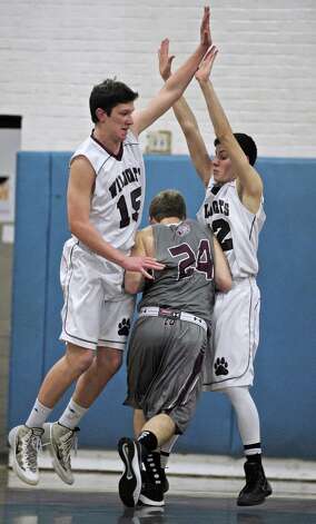 North Haven's Michael gagliardi (24) tries to drive between Bethel's ...