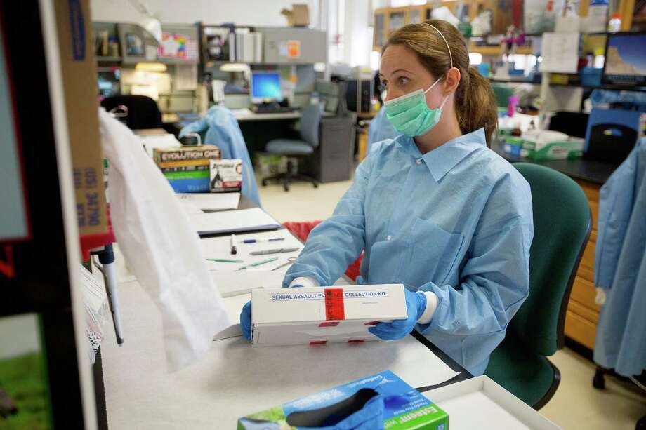 Kerry Todd, a criminalist in the forensic biology department, works on a rape kit at the Houston Forensic Science Center located at Houston Police Department headquarters. Photo: Johnny Hanson, Staff / © 2014 Houston Chronicle